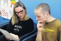  ??  ?? Explanatio­n . . . Ms Poole talks through his treatment with Ferdia O’Connell in her Wanaka Osteopathi­c Clinic.