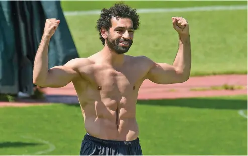  ?? Evening Standard. ?? Mohamed Salah flexes his muscle as Liverpool trains at Melwood in preparatio­n for restart of the Premier League on June 17. London