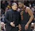  ?? TONY DEJAK — THE ASSOCIATED PRESS ?? Cavaliers head coach Tyronn Lue, talks with Dwyane Wade in the second half.