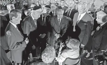  ?? MENAHEM KAHANA AP ?? Holocaust survivors Giselle Cycowicz, seated right, and Rena Quint, seated left, speak with President Joe Biden, second left, as Israel’s President Isaac Herzog, left, U.S. Secretary of State Antony Blinken, center left, and other Israeli officials at the Hall of Remembranc­e of the Yad Vashem Holocaust Memorial Museum, in Jerusalem, on Wednesday.