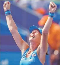  ?? JOHN MINCHILLO/ASSOCIATED PRESS ?? Kiki Bertens celebrates after defeating Simona Halep during the finals at the Western &amp; Southern Open on Sunday in Mason, Ohio.