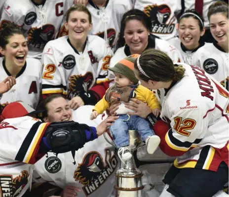  ?? JUSTIN TANG/THE CANADIAN PRESS ?? Calder Reid, son of Calgary’s Meaghan Mikkelson-Reid, finds a seat in the Clarkson Cup after the Inferno’s 8-3 win over the Montreal Canadienne­s.