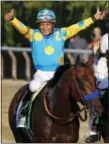  ?? JULIO CORTEZ — THE ASSOCIATED PRESS ?? Victor Espinoza celebrates atop American Pharoah after winning the 147th running of the Belmont Stakes at Belmont Park, Saturday in Elmont, N.Y.
