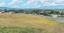  ?? ?? 80 Summerhill Drive, Mooroobool: A whopping 1170sq m block at City View Estate with city, ocean and mountain views to Walshs Pyramid, no easements and establishe­d trees on one side is on the market for $699,000. Soil tests, survey and building plans are available for the land surrounded by superior homes in a sought-after location.