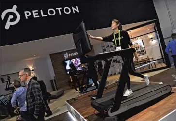  ?? Ethan Miller Getty Images ?? A PELOTON treadmill is used in 2018. The Consumer Product Safety Commission issued an “urgent warning” over the company’s Tread+, but CEO John Foley said it had “no intention” of recalling the $4,300 product.