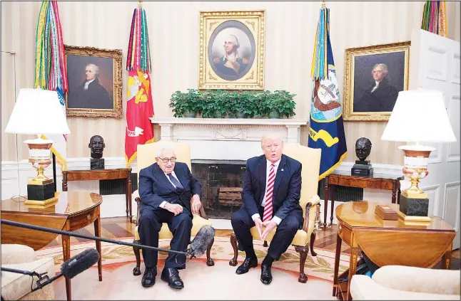  ??  ?? US President Donald Trump (right), speaks with former US secretary of state Henry Kissinger during a meeting in the Oval Office of the White House in Washington, DC, May 10.
(AFP)