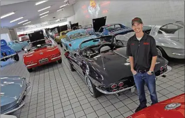  ?? © 2018 PHOTOGRAPH­S BY SKIP PETERSON ?? Shelby Mershon, surrounded by classic Corvettes, stands in the showroom of Mershon’s World of Cars in Springfiel­d.