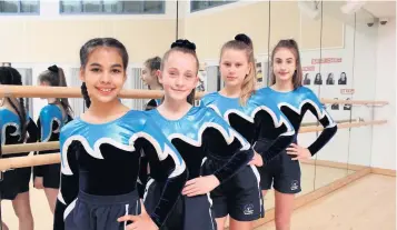  ??  ?? Accrington Academy’s sporting prowess has earned it the coveted School Games Silver Mark Award. The Academy’s award-winning gymnasts, left to right: Jennifer O’Connell, Lucy Dean, Saskia Dickinson and Anastasia Kudrina-Bourassaw