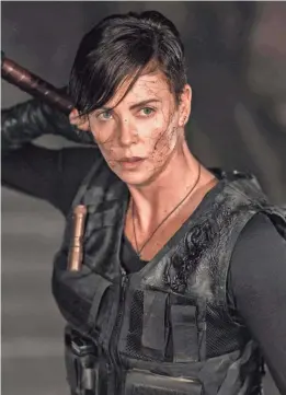  ?? PHOTOS BY AIMEE SPINKS/NETFLIX ?? Charlize Theron plays Andy in “The Old Guard” – an immortal warrior who has lived for thousands of years.