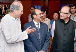  ?? — PTI ?? Union finance minister Arun Jaitley (right) with CII president Ajay Shriram (centre) and Bajaj Auto chairman Rahul Bajaj (left) during the CII’s National Conference and Annual Session 2015 “Building India: A Shared Responsibi­lity” in New Delhi on Monday.
