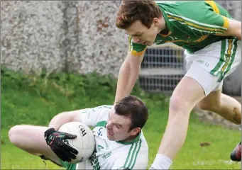  ??  ?? Darragh Madden of Eastern Harps is tackled to the ground by Gary Gaughan.