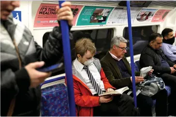  ??  ?? SAFETY FIRST: Passengers on public transport wearing facemasks to guard against the virus
Picture: REUTERS