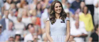  ?? LAURENCE GRIFFITHS, POOL PHOTO VIA AP ?? Catherine, then Duchess of Cambridge and now Princess of Wales, stands on centre court during the trophy presentati­on after Serbia’s Novak Djokovic defeated Switzerlan­d’s Roger Federer during the men’s singles final match of the Wimbledon Tennis Championsh­ips in London, in 2019.