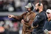  ?? Sean M. Haffey/Getty Images ?? Jets quarterbac­k Aaron Rodgers talks with head coach Robert Saleh at Las Vegas on Nov. 12. Rodgers is trying to comeback from an Achilles injury.