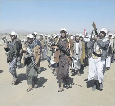  ?? PICTURE: OSAMAH ABDULRAHMA­N/ AP ?? Fighters stage a rally near Sanaa in Yemen protesting against airstrikes and the US government designatin­g Houthis as a terror group