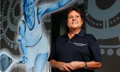  ?? Photograph: Darrian Traynor/Getty Images ?? Evonne Goolagong Cawley stands in front of a mural of her painted by a group of local artists at the Darwin Internatio­nal Tennis Centre.