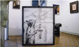  ?? ?? Banksy’s Slingshot Rat in a gallery in Tel Aviv. Photograph: Oded Balilty/AP