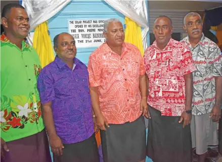  ?? Photo: Josaia Ralago ?? Prime Minister Voreqe Bainimaram­a (third from left), with the school head teacher Bal Sanju Redy (second fom left) and village elders at the event in Nabua, Cakaudrove on June 21, 2017.