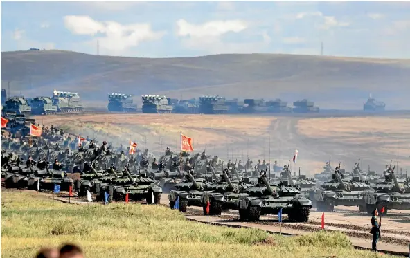  ?? AP ?? Chinese tanks roll during a military exercises on training ground Tsugol, about 250km south-east of the city of Chita during the military exercises Vostok 2018 in Eastern Siberia, Russia.