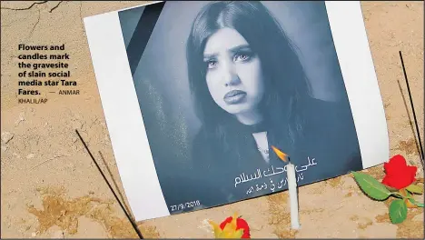  ?? — ANMAR KHALIL/AP ?? Flowers and candles mark the gravesite of slain social media star Tara Fares.