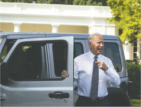  ?? AL DRAGO / BLOOMBERG FILES ?? U.S. President Joe Biden speaks to members of the media after driving a Jeep Wrangler Rubicon
electric vehicle during an event on the South Lawn of the White House last Thursday.