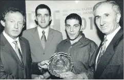  ?? ?? Tadhg Dunne, Ballindang­an, Mitchelsto­wn, Avondhu winner of the FBD Young Farmer of the Future in 2001 accepting his award from, l-r: IFA president, Tom Parlon; Macra President, Seamus Phelan and Seamus McCormack, FBD.