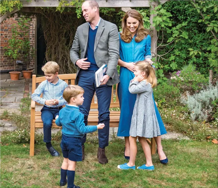  ??  ?? FORCE OF NATURE: The Duke, clutching a copy of Sir David’s new book, and the rest of the family chat excitedly to the veteran broadcaste­r