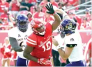  ?? Michael Wyke/Houston Chronicle via AP, File ?? ■ Houston defensive tackle Ed Oliver (10) tries to break up a pass by East Carolina quarterbac­k Gardner Minshew (5) during the first half of an NCAA college football game on Nov. 4, 2017, in Houston. Oliver was selected to the AP Preseason All-America team on Tuesday.