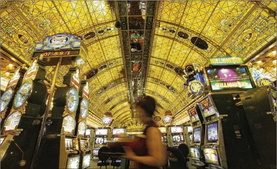  ?? AP 2007 ?? One of the more iconic parts of the Tropicana was the $1 million green-and-amber stained glass ceiling installed in 1979 above the casino floor.