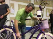  ?? SUBMITTED PHOTO ?? Embreevill­e’s Tom O’Neill, carpenter for Pine Street Carpenters and one of Santa’s elves at the remodeling firm’s annual bike-build, is set to assemble bikes at Pine Street’s “100 Wheels Project” event this Thursday.