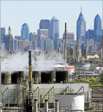  ?? ASSOCIATED PRESS ?? A look at Philadelph­ia Energy Solutions refinery complex in southwest Philadelph­ia. The refinery is the oldest and largest refinery on the East Coast. Workers are being notified they are being laid off as the site is being shut down after a massive explosion in June.