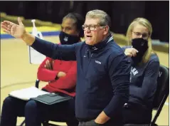  ?? David Butler II / Associated Press ?? UConn coach Geno Auriemma tied Tennessee legend Pat Summitt for second on the all-time career wins list with the Huskies’ victory on Saturday.