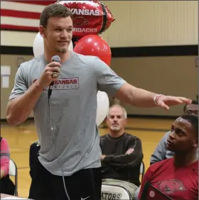  ?? (Arkansas Democrat-Gazette/Thomas Metthe) ?? JT Towers addresses the crowd at his signing ceremony at Joe T. Robinson High School in Little Rock on Wednesday. Towers, a linebacker, signed a national letter of intent to play at Arkansas. “It’s a day I anticipate­d for a long time,” Towers said. More photos are available at arkansason­line.com/26jtrsigni­ng.