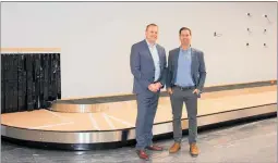  ??  ?? Hawke’s Bay Airport chief executive Stuart Ainslie and commercial manager Dean Smith in the airport’s new arrivals hall, a key feature of which will be a new automated baggage system.