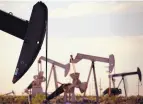  ?? ASSOCIATED PRESS ?? Pumpjacks work in a field in Lovington. New Mexico officials are looking to streamline rules on treatment and resue of wastewater.