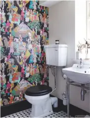  ??  ?? CLOAKROOM ‘I made braver choices in the bathroom and cloakroom, where characterf­ul wallpaper really brought the spaces to life,’ says Georgina. Dara wallpaper in Noir by Manuel Canovas, £135 a roll, wallpaper Direct