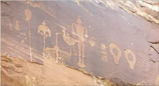  ??  ?? PETROGLYPH­S are marred by bullet holes. Utah’s GOP congressio­nal bloc is working to amend the Antiquitie­s Act so presidents can’t act on their own to protect large areas of federal land.