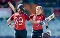  ?? AFP ?? WELL DONE: England’s Heather Knight (right) celebrates reaching her century with teammate Natalie Sciver. —