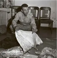  ??  ?? ABOVE RIGHT: Major Jesse A Marcel holding foil debris from Roswell in 1947.