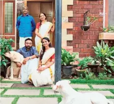  ?? ?? Basil Thomas and his family with their pet dog Kunji.