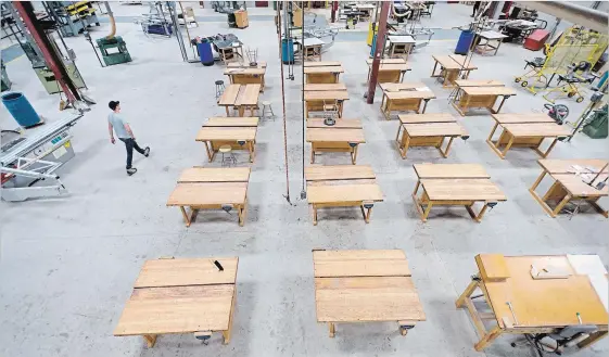  ?? MATHEW MCCARTHY WATERLOO REGION RECORD ?? Work tables sit in rows at the Woodworkin­g Centre of Ontario at Conestoga College. It’s the largest woodworkin­g training facility in North America.