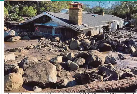  ?? AGENCY PIX ?? A damaged house is surrounded by large boulders and debris following mudslides in Montecito, California, on Wednesday.