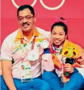  ??  ?? (ABOVE) AFTER MIRABHAI CHANU’S 2018 COMMONWEA LTH GAMES (GOLD MEDAL) PERFORMANC E, COACH VIJAY SHARMA BELIEVED THEY COULD WIN A MEDAL IN THE OLYMPICS). THEY ALSO DOUBLED THEIR EFFORTS AFTER THE RIO OLYMPICS DEFEAT