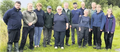  ??  ?? Line-up
Volunteers and reserve staff at Loch Leven National Nature Reserve with Louise Clark second from the right. Pic by Lorne Gill/SNH