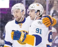  ?? CHRIS YOUNG/THE CANADIAN PRESS/FILES ?? Two storylines heading into NHL free agency surround a pair of New York Islanders with expiring contracts, defenceman Calvin de Haan, left, and forward John Tavares.