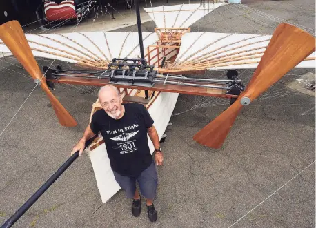  ?? Ned Gerard / Hearst Connecticu­t Media ?? Andy Kosch stands next to his replica of Gustave Whitehead’s “No. 21” airplane, currently on display at the Connecticu­t Air and Space Museum, in Stratford on Aug. 3,.The working replica, which Kosch flew in 1986, is a re-creation of aviation pioneer Gustave Whitehead’s 1901 airplane, which some credit for being the first powered aircraft to take flight.