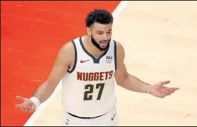  ?? KEVIN C. COX / Getty Images ?? Jamal Murray and the Nuggets had a chance to beat the Wizards on Thursday night, but let it slip away.