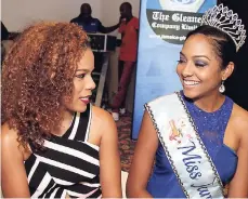  ??  ?? Reigning Miss Jamaica World Laurie-Ann Chin (right) enjoys some girl talk with Soyini Phillips.