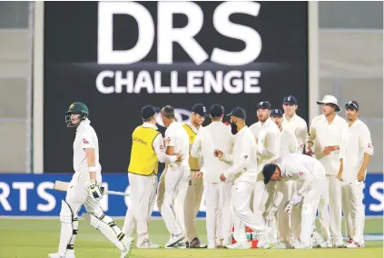  ?? Picture: Reuters ?? VINDICATED. England players celebrate after having the call not to give Australian captain Steve Smith out lbw overturned by the third umpire during the second Ashes Test in Adelaide yesterday.