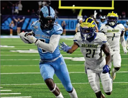  ?? Photo by Michael Derr / The Independen­t ?? Preseason All-American wide reciever Aaron Parker, left, and the URI football team dropped a triple-overtime thriller to Delaware in the first night game in Meade Stadium history Saturday night. Park caught 12 passes for 227 yards.